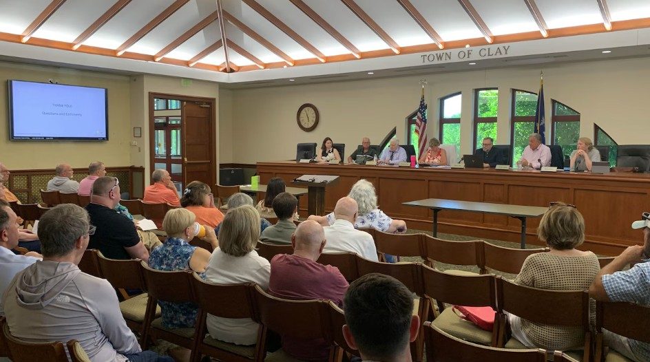 Residents fill the Town of Clay board room for the Micron Community Host Agreement meeting, July 2026