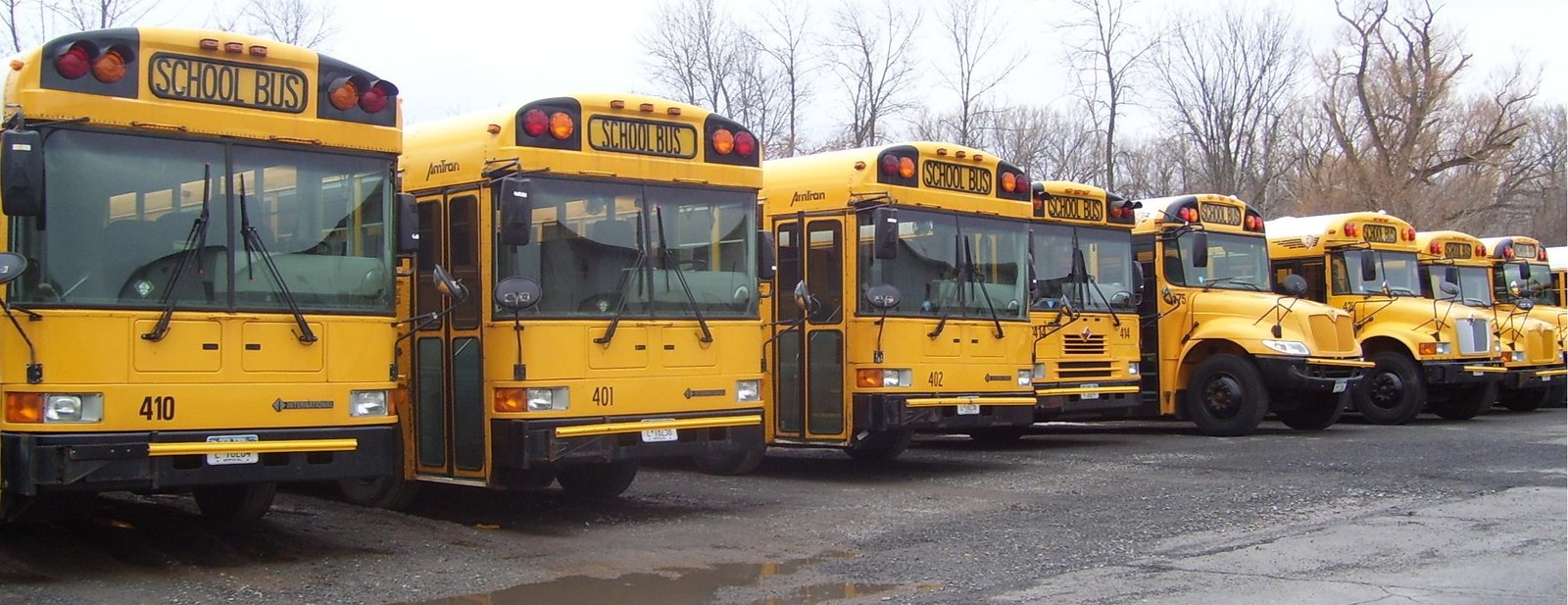 North Syracuse Central School District buses lined up in the fleet yard
